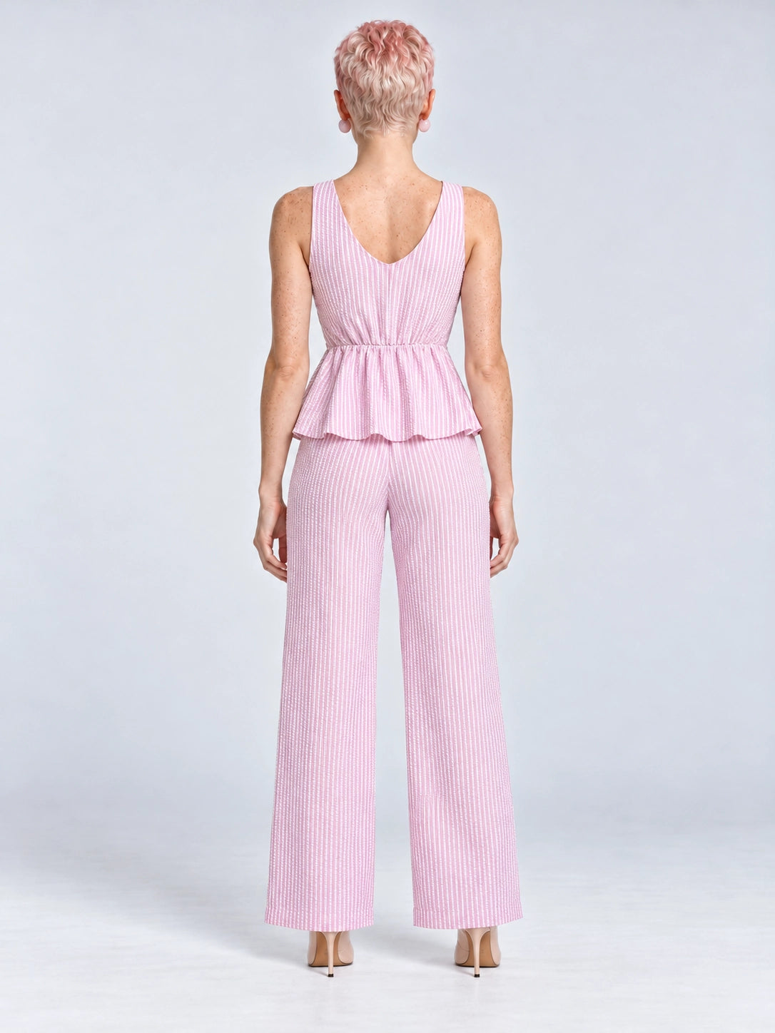 Conjunto Amalfi rosa a rayas, vista posterior con blusa y pantalón